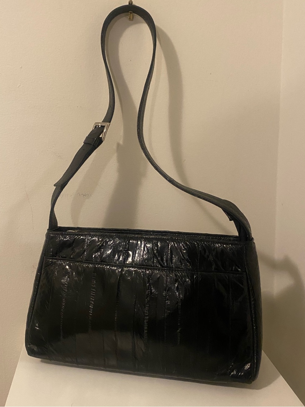 Sleek Black Eel Skin Shoulder Bag with Adjustable Strap